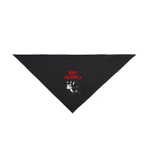 May include: A black triangular pet bandana featuring a graphic of a small, stylized black and white creature with horns. Above the creature, the text NOT FRIENDLY is printed in bold red capital letters. The design is centered on the fabric.