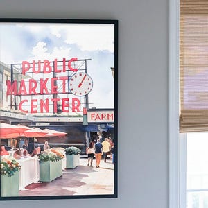 Callaghan Collective Watercolor Painting of Pike Place Market in Seattle Washington featuring the Public Market Center sign, red umbrellas, and the Farmers Market crowd, Pacific Northwest wall art for apartment or office decor.