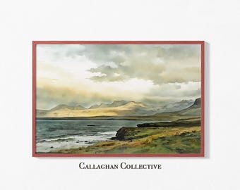May include: Watercolor landscape art print in a red frame. The artwork depicts a coastal scene with mountains, a body of water, and a cloudy sky. The text "Callaghan Collective" is at the bottom of the frame.