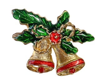 May include: Gold-tone Christmas bell brooch with red and green enamel. The bells are adorned with holly leaves and a red berry.