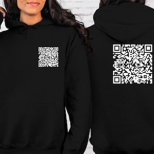 May include: Black hoodie with a white QR code printed on the front and back.