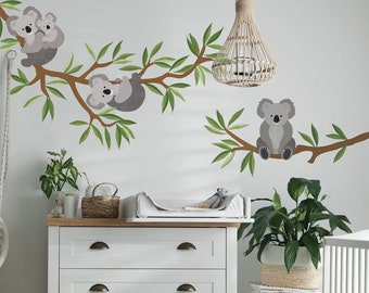 Sticker mural Koalas sur branche avec fleurs (118 x 54 cm)