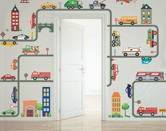 May include: A set of colorful vehicle and building wall decals for a child's room. The decals feature a variety of vehicles, including a school bus, a fire truck, a police car, and an ambulance. The decals also feature buildings, including a house, a school, and a fire station. The decals are arranged in a pattern that resembles a city street.