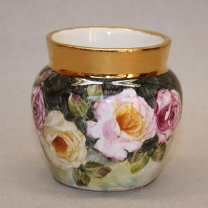 Miniatyrrosvas: Handmålad blommig keramisk kruka