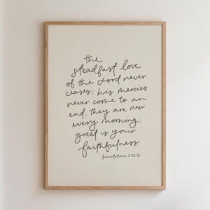 May include: A white ceramic mug with a black handle and the text "But First, Coffee" in a handwritten style. The mug is on a white surface. The mug is 4 inches tall.