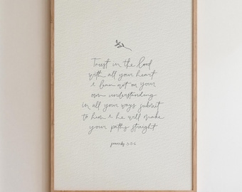 May include: A framed wall art print featuring black handwritten text on a textured off-white background. The text reads: Trust in the Lord with all your heart and lean not on your own understanding; in all your ways submit to him, and he will make your paths straight. Proverbs 3:5-6.
