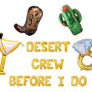 May include: A collection of gold foil balloons spelling "DESERT CREW BEFORE I DO", with individual balloons shaped like a cowboy boot, cactus, martini glass, and diamond ring. The balloons are designed for a bachelorette party.