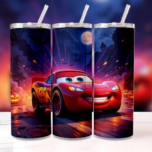 May include: A set of three stainless steel tumblers with a Halloween-themed design. Each tumbler features a vibrant image of Lightning McQueen from the movie Cars, set against a spooky night scene with pumpkins and a full moon.