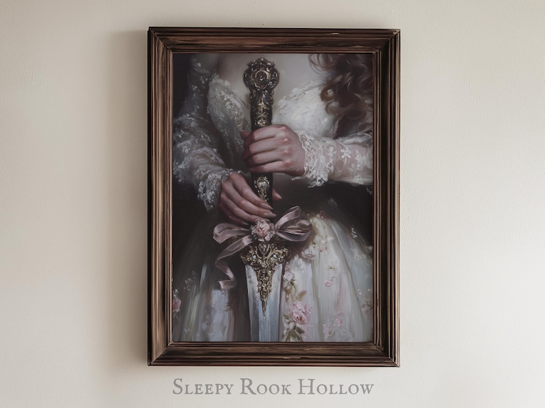 May include: A framed painting of a woman in a white dress holding a decorative sword with a floral design. The sword has a gold and silver finish and is adorned with pink and white flowers. The woman's hands are visible, and she is wearing a white lace dress with floral accents. The frame is brown wood.