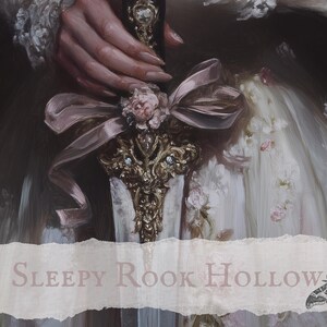 May include: A hand holding a gold and jeweled sword with a pink ribbon and a flower. The sword is surrounded by a white fabric with floral embroidery. The text "SLEEPY ROOK HOLLOW" is visible at the bottom of the image.