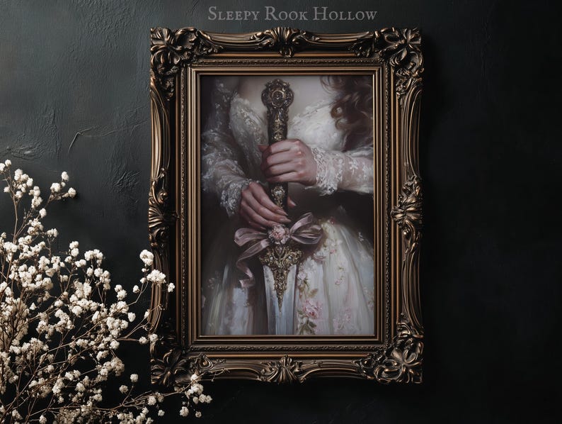 May include: A framed painting of a woman in a white dress holding a sword with a pink ribbon. The sword has a gold handle and a silver blade. The frame is ornate and gold.