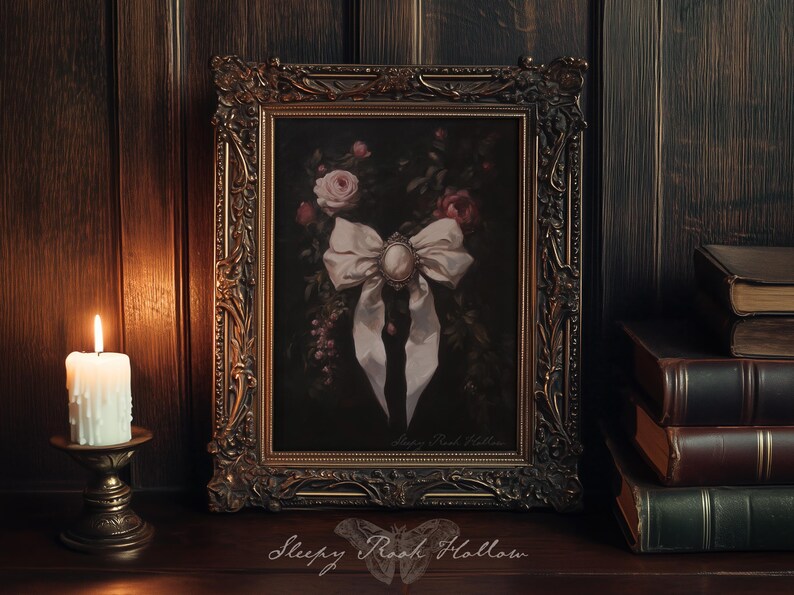 May include: An ornate framed painting featuring a large white bow with a central cameo, surrounded by roses and foliage. The frame is gold-toned, and a lit candle sits to the left. The text "Sleepy Rock Hollow" is at the bottom.