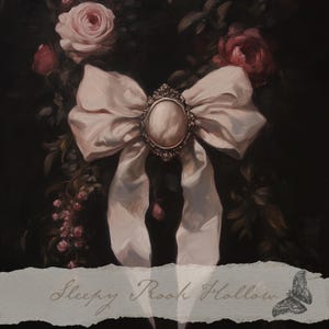 May include: A painting of a large, light pink bow with a decorative brooch at its center. The bow is set against a dark background with pink roses and the text "Sleepy Rook Hollow". A butterfly illustration is also present.