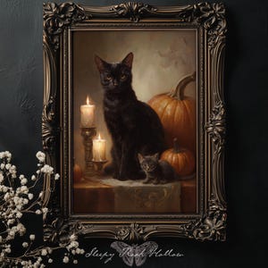 May include: A framed vintage-style painting featuring a black cat and kitten, pumpkins, and lit candles. The artwork has a dark, gothic aesthetic, with a decorative, ornate frame. The painting is set against a dark background.