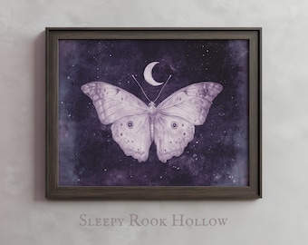 May include: A framed print of a white butterfly with a crescent moon above it, set against a purple and black starry night sky. The print is titled "Sleepy Rook Hollow".
