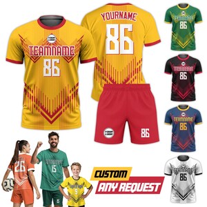 May include: Yellow and red athletic jersey with the text "TEAMNAME" and the number "86". A pair of red shorts with the number "86" is also shown. Additional jerseys in green, black, blue, and white are displayed.