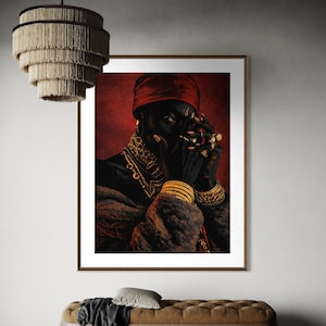 May include: A framed portrait of a person with dark skin, wearing a red head covering, gold jewelry, and a fur-trimmed coat. The person's hands are adorned with rings and are near their face. The background is a deep red.