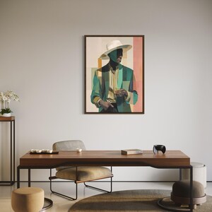 May include: An abstract painting of a person wearing a white hat and a green blazer, holding a glass. The artwork is framed and hangs on a neutral wall. The room features a wooden desk, a round rug, and a small side table.