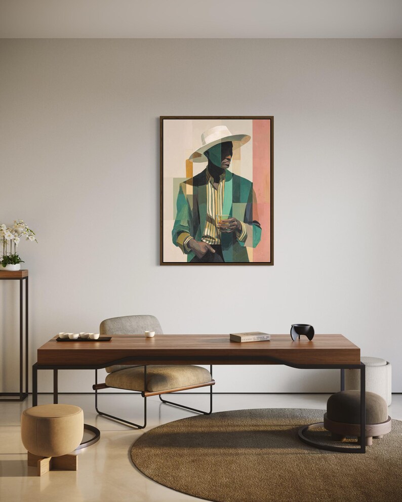 May include: An abstract painting of a person wearing a white hat and a green blazer, holding a glass. The artwork is framed and hangs on a neutral wall. The room features a wooden desk, a round rug, and a small side table.