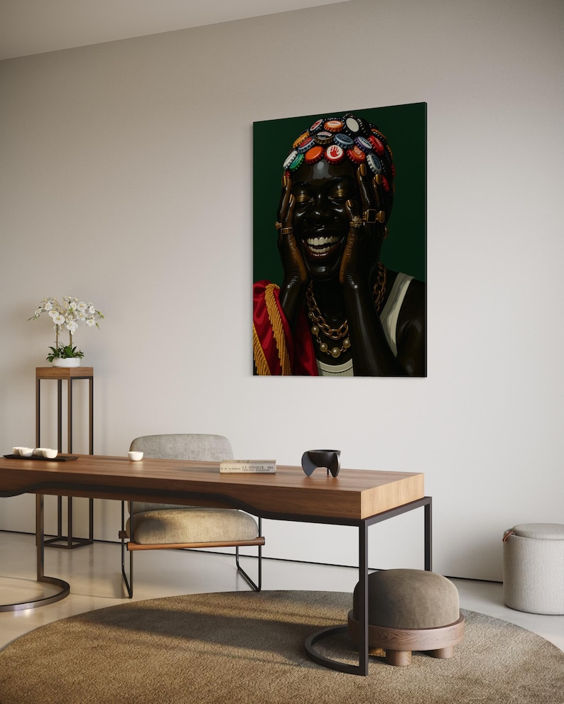 May include: A framed art print featuring a person with a dark complexion, adorned with a headpiece made of bottle caps. The person is laughing, wearing gold jewelry and a white top, set against a dark green background.