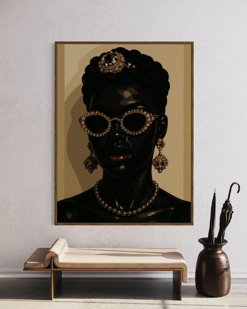 May include: A framed portrait of a person with dark skin, wearing gold-rimmed sunglasses, a jeweled crown, and pearl necklace. The artwork features gold earrings and a dark background. The portrait is displayed above a bench and next to a vase.