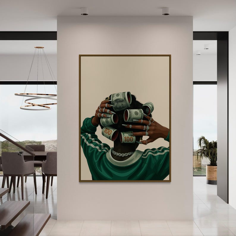 May include: A framed art print depicts a person with dollar bills rolled into curlers. The person wears a green and white track suit and a silver chain. The artwork is displayed in a modern, well-lit interior.