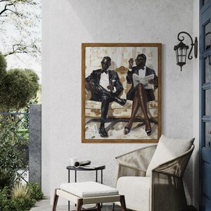 May include: An oil painting in a wooden frame depicts two figures in tuxedos seated on a sofa. The artwork hangs above a woven chair and ottoman on a patio. A small table holds a mug and rolled newspaper.