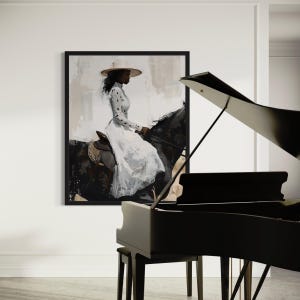 May include: A framed art print showing a person on horseback, wearing a white dress and hat. The horse is black. The artwork is on a white wall, with a black piano in the foreground. The image is a painting.