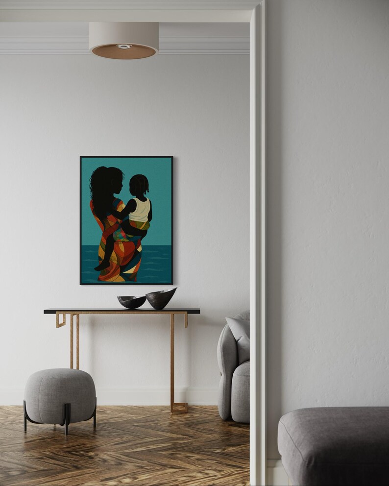 May include: A framed art print depicts a silhouette of a person holding a child, set against a teal background with a water-like design. The person's clothing features a colorful pattern of red, orange, and yellow.