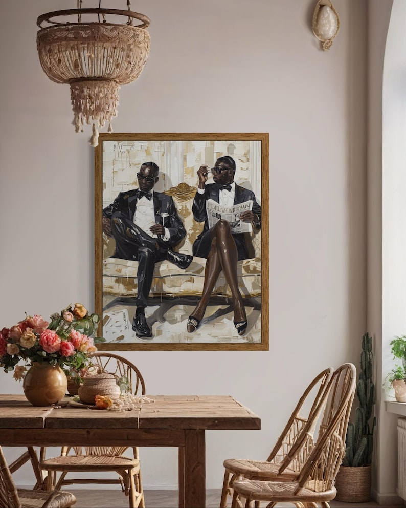 May include: A framed artwork depicts two figures in formal attire, seated on a bench. One holds a newspaper with the text "The American". The painting is in a room with a wooden table, chairs, and a chandelier.