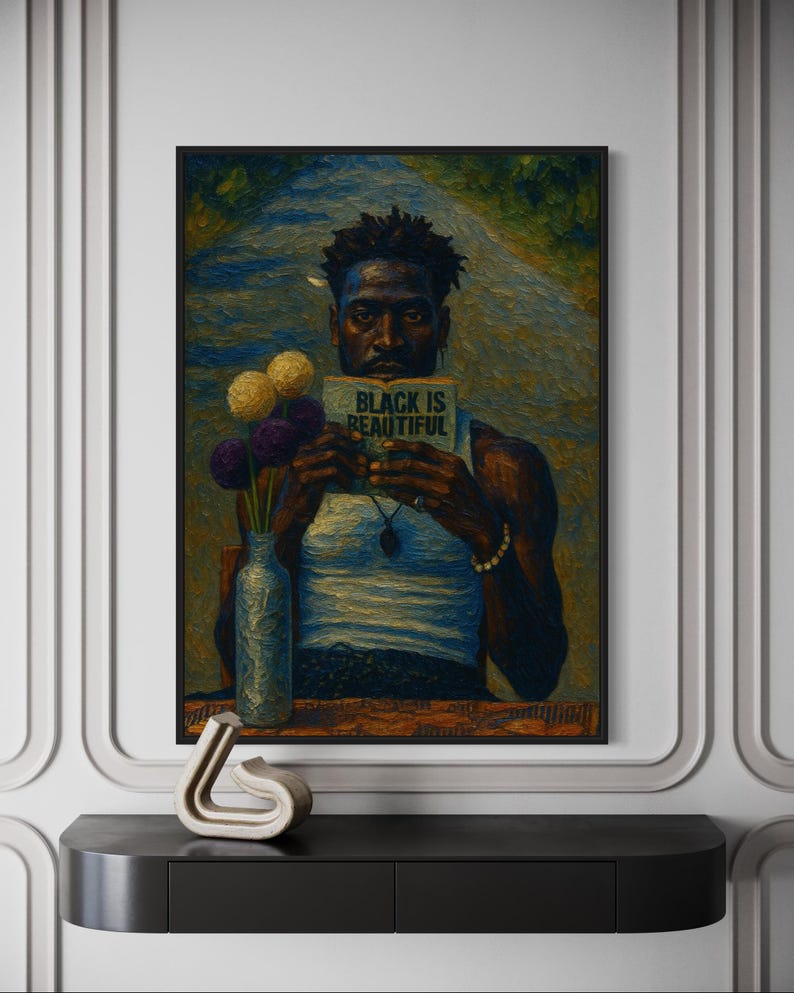 May include: An artistic painting of a person holding a book with the text "BLACK IS BEAUTIFUL." The person is wearing a white tank top and a necklace. A vase with flowers is on a table. The painting is framed in a black frame.