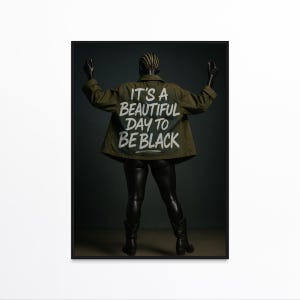 May include: A poster featuring a mannequin wearing a green jacket with the text "IT'S A BEAUTIFUL DAY TO BE BLACK" in white. The mannequin is wearing black leggings and boots, with arms raised. The background is a dark gray.