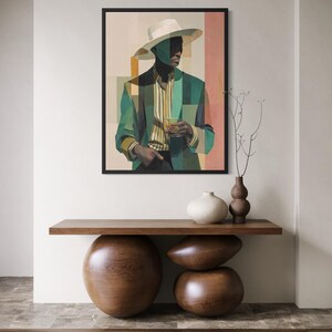 May include: A framed art print featuring a geometric portrait of a person in a hat and blazer, holding a drink. The artwork is in shades of green, beige, and pink. The print is displayed above a wooden console table with decorative wooden spheres and vases.