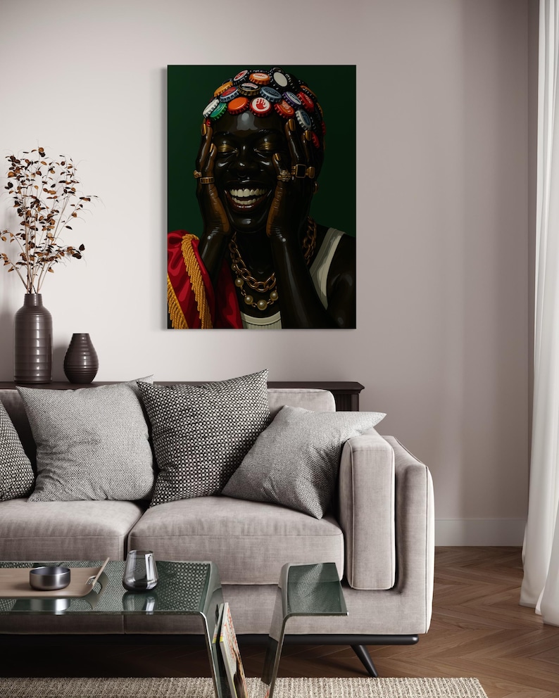 May include: A canvas art print features a person with dark skin, adorned with bottle caps on their head and gold jewelry. The person is laughing, with hands near their face. The background is a deep green, and the person is wearing a white top and a red and gold shawl.