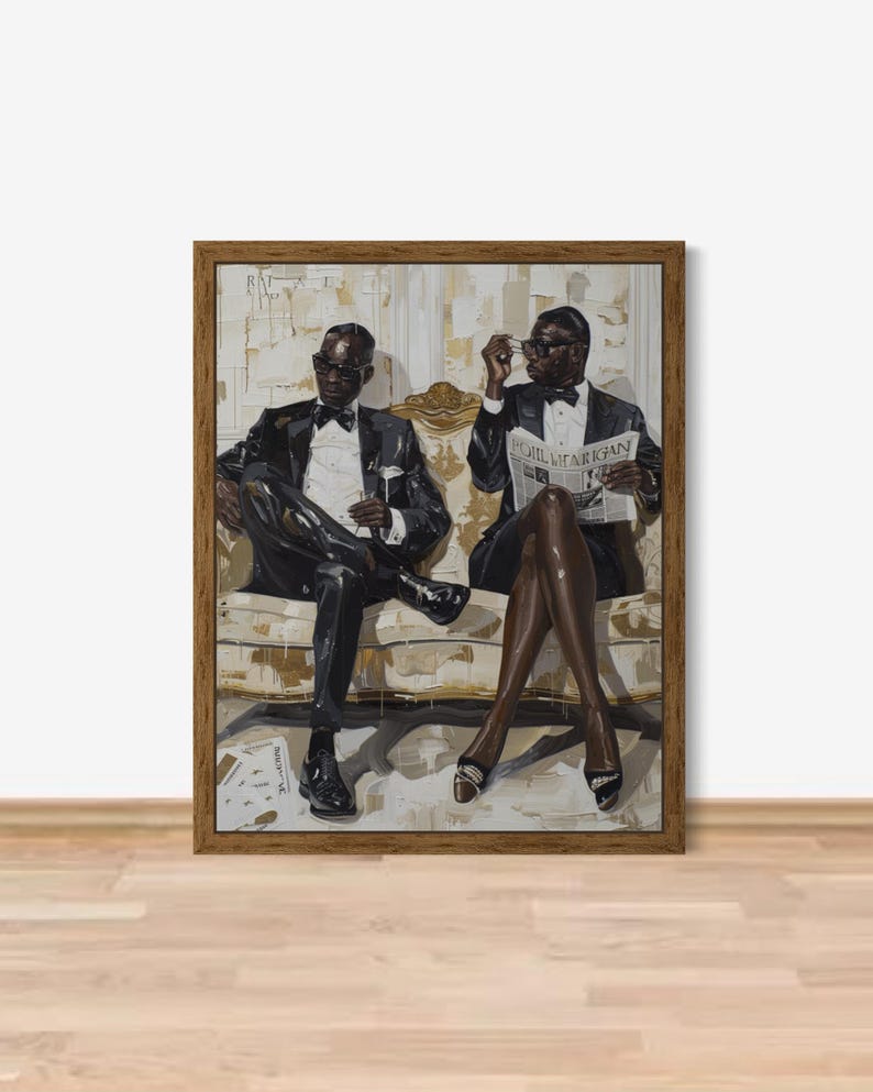 May include: Framed artwork featuring two figures in formal attire seated on a patterned sofa. One figure holds a newspaper, the other a glass. The artwork has a neutral color palette with a brown wooden frame.