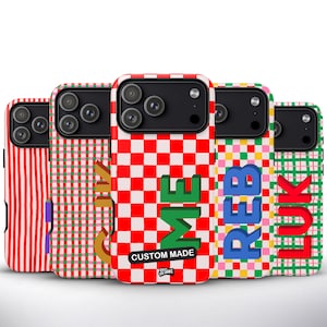 May include: Five phone cases with diverse patterns are displayed. Designs include red and white stripes, green and white gingham, and a red and white chequered pattern. Text on the cases reads "ME", "REB", and "LUK", plus "CUSTOM MADE".