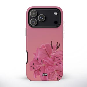 May include: Pink phone case featuring a vibrant pink lily flower design. The case has a smooth finish and a gradient background. The phone case has a black camera module and black side buttons. The case is made of durable material.