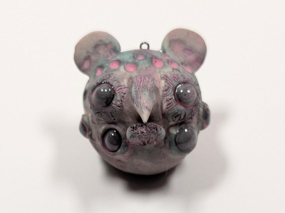 A polymer clay mutant rat sculpture with horror-film energy — clearly hand-sculpted, deeply weird, and exactly the kind of thing you can't un-see once you've seen it.
