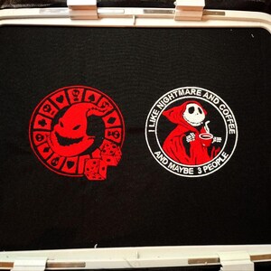 May include: Embroidered design on black fabric featuring a red and white Jack Skellington character with the text "I like nightmare and coffee and maybe 3 people".