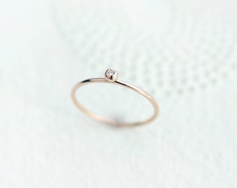 Tiny Diamond Solitaire 18kt Gold ring