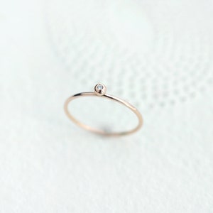 Tiny Diamond Solitaire 18kt Gold ring image 1