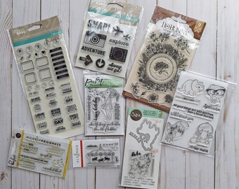 8 sets of lightly used clear stamps and one die