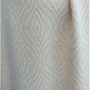 May include: A close-up of a beige fabric with a white diamond pattern. The fabric has a subtle texture and a soft, woven look.