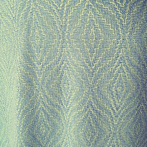 May include: A close-up of a blue and yellow patterned fabric with a subtle diamond pattern.