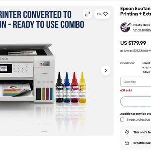 May include: White Epson EcoTank ET-2850 printer converted for sublimation printing, ready to use. The image shows the printer with a colourful printout and four ink bottles. Text on the image reads "75% pre-filled ink + 4 extra bottles."