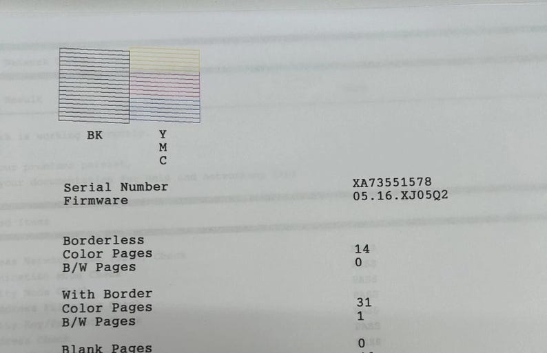 May include: Printed document with colour and black ink test patterns. Includes text labels: BK, Y, M, C, Serial Number, Firmware, Borderless, With Border, Color Pages, B/W Pages, and Blank Pages. The serial number is XA73551578.