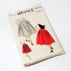 May include: A vintage sewing pattern for a skirt, featuring three different styles. The pattern is from Advance, pattern number 6812, and is for a waist size of 24 inches. The skirt styles include a gray skirt, a red skirt, and a red and white patterned skirt.