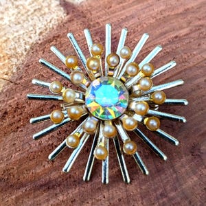 Vintage rhinestone starburst pendant