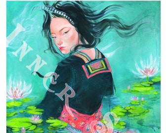 May include: A woman with long black hair wears a colorful patterned dress and a black top with a red and white trim. She is standing in a pond with water lilies and green lily pads.