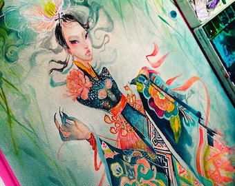 May include: Watercolor painting of a woman in a traditional Asian-inspired outfit. The artwork features a teal, blue, and orange color palette. The woman has dark hair and is adorned with floral and patterned details. The painting is set against a soft, green background.